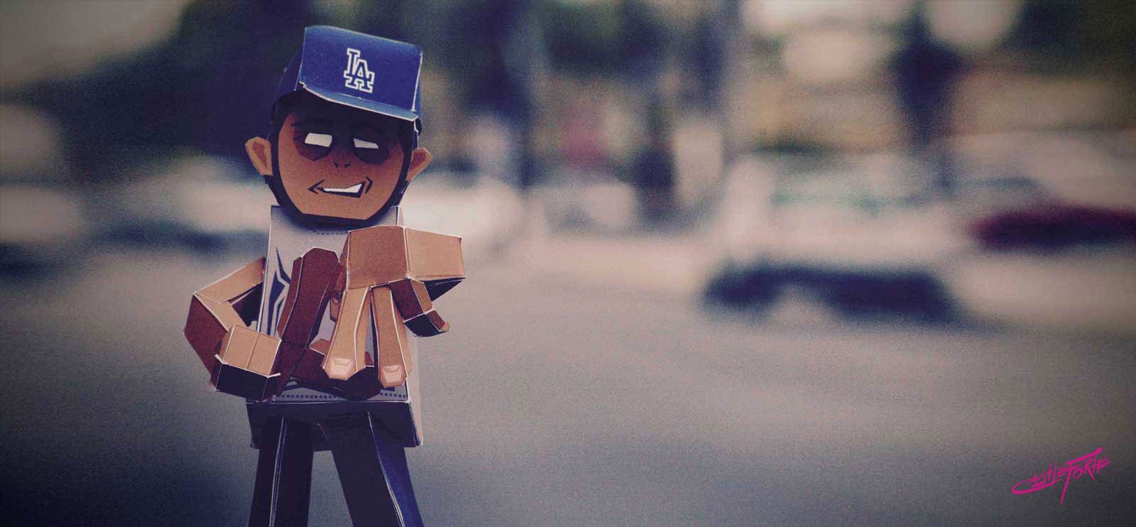 LA Guy paper toy photographed on the street